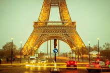 Base of the Eiffel Tower in the early evening.