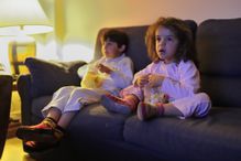 Children watching horror movie.