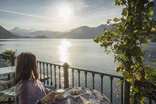 Woman having Cappuccino on Lake Como