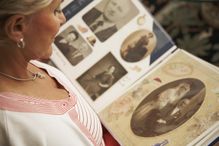 Woman looking at a family photo album