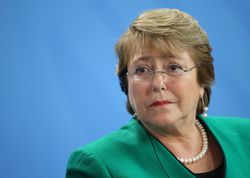 Chilean President Bachelet head shot on a blue background.