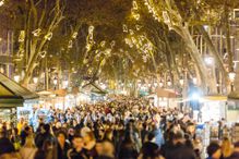 People walking at La Rambla street during Christmas and New Year holidays in Barcelona, Catalonia, Spain