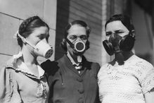 Picture of three girls wearing Dust Bowl masks.