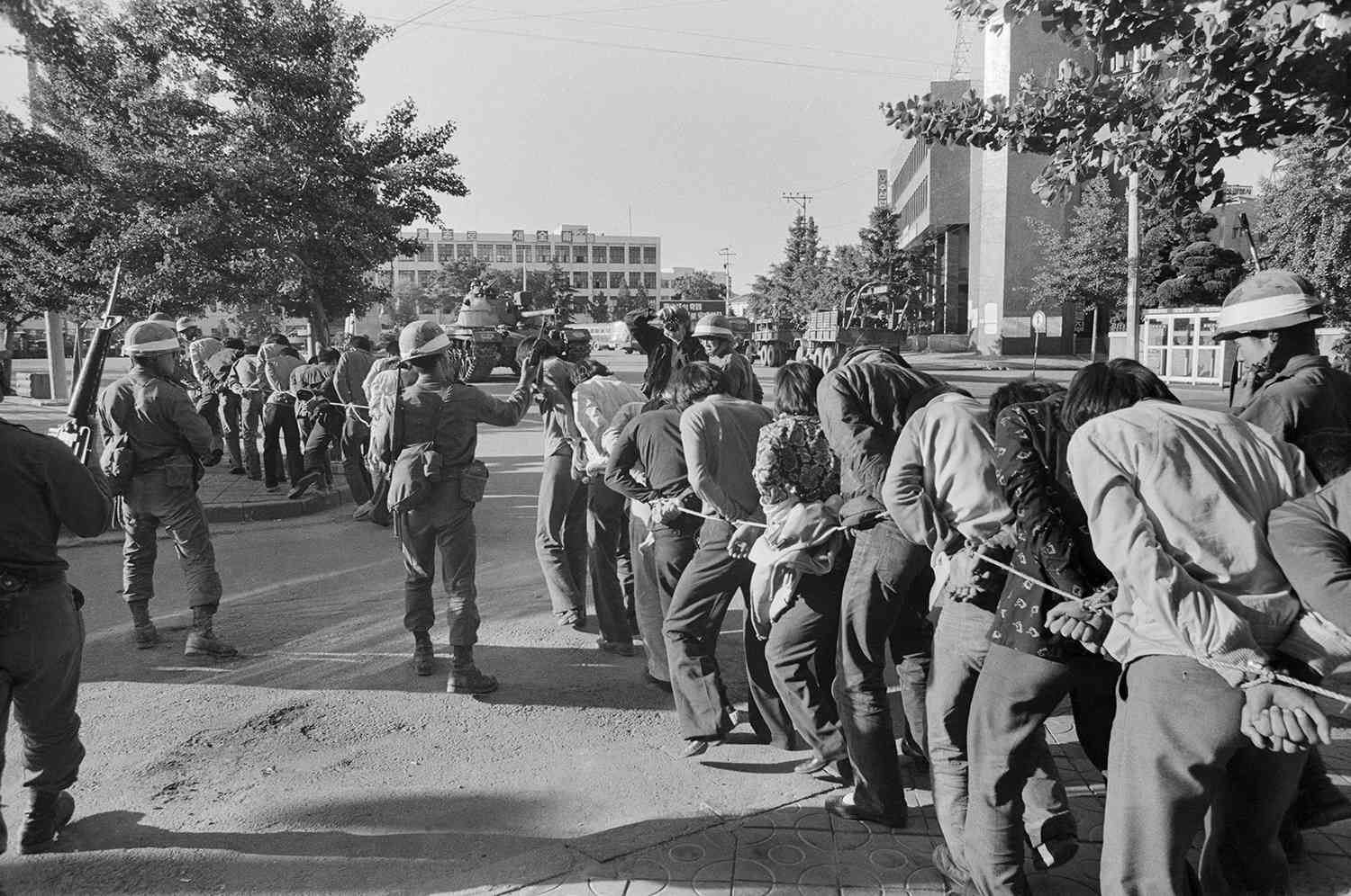 Korean Students Restrained by Army Forces