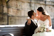 Bride sitting on groom&#39;s lap