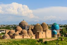 Medieval mausoleums echo the distant mountains' shapes, Samarkand, Uzbekistan.