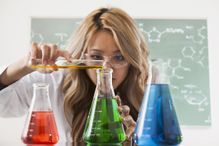 woman in laboratory testing liquids