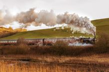 Heritage Steam Train Passing By Landscape Against Sky