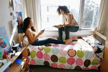 College students relaxing in dorm