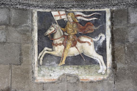 Medieval fresco depicting a knight templar on a horse