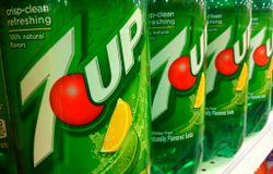 Liter bottles of 7UP on a grocery shelf