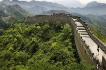 Young woman jogging on Great Wall of China, rear view