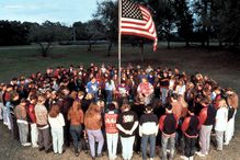 prayer circle around American flag