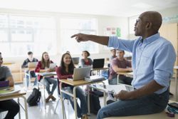 School teacher instructing a class