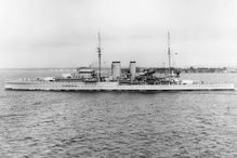 Black and white photograph of the HMS Exeter on the water.