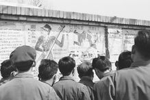 Beijing residents read posters chastising "Gang of Four" on Beijing's "Democracy Wall,"