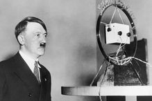 February 1933: Nazi leader Adolf Hitler (1889 - 1945) makes his first radio broadcast as German Chancellor in front of a radio microphone.