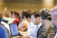 Man using laptop in class