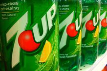 Liter bottles of 7UP on a grocery shelf