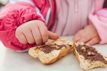 Toddler with baguette