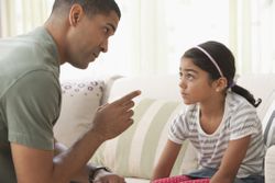 Father giving daughter lecture