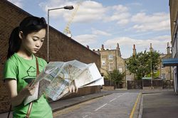 Portrait of woman looking at a street map