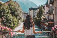 rear view of woman in Chamonix-Mont Blanc village and French alps