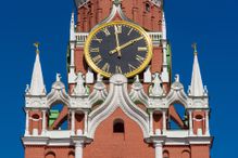 Kremlin Clock on the Spasskaya Tower of Kremlin palace against blue sky in Moscow,Russia