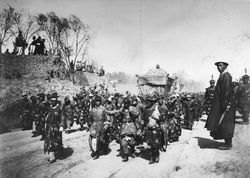 Manchu honor guards carry Empress Cixi's casket at her funeral procession