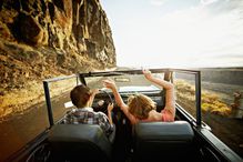 Hands up in convertible truck