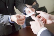 business people exchanging a business card