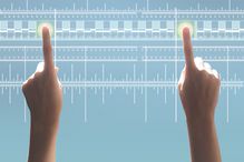 A person touches two spots on a digital ruler, illustrating the concept of a scale of measurement.