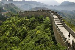 Young woman jogging on Great Wall of China, rear view