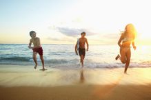 Children running on the beach