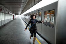 Woman is late for a train and trying to catch it