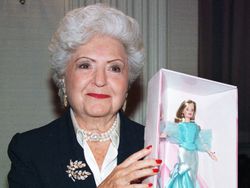 Ruth Handler holds a Barbie doll, 1999.