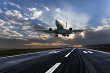 Passenger airplane landing at dusk