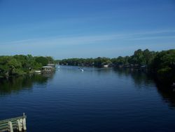 Saint Johns River in Florida stretching into a blue sky.