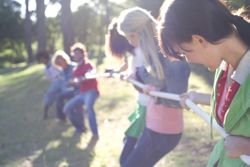 Friends play tug of war.