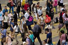 Crowd of people crossing street