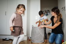 Mom cleaning up with her kids