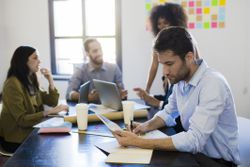 Businessman analyting data during a meeting in office