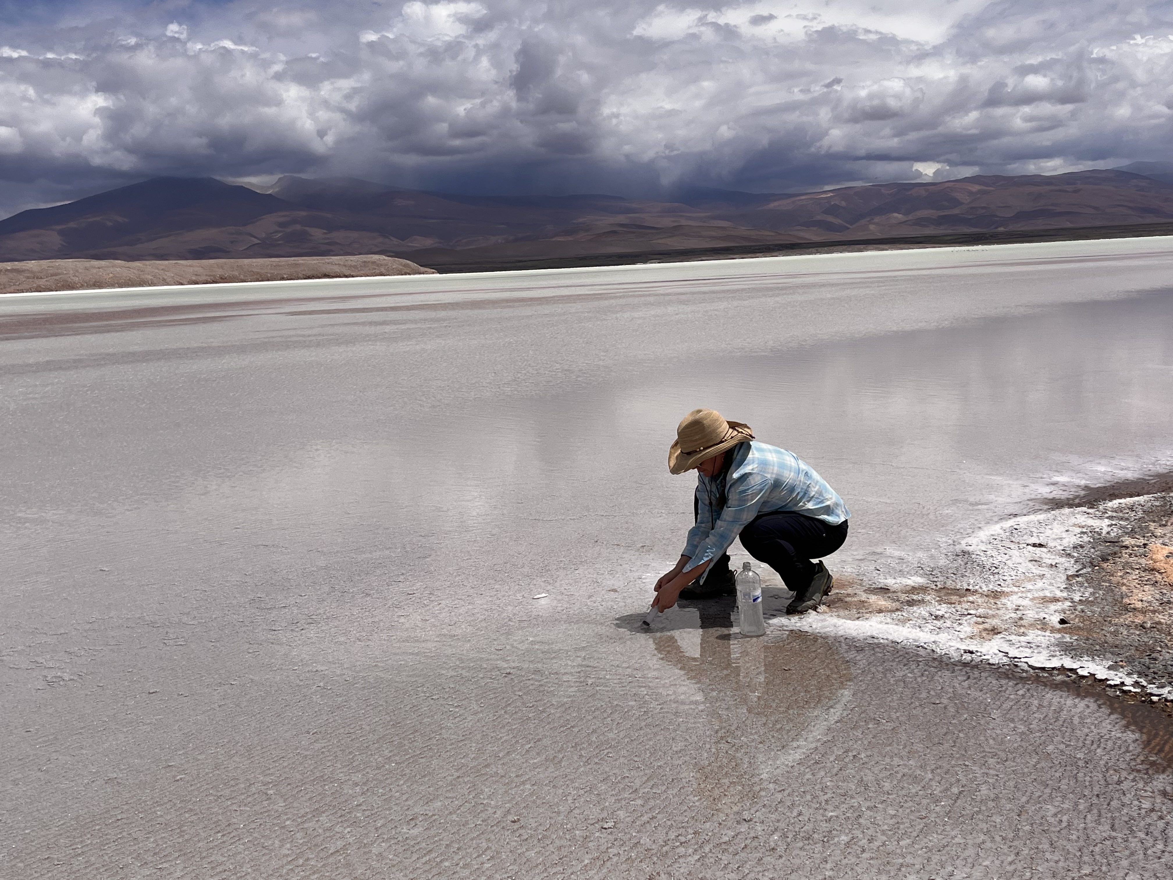 Lee Ann Munk gets a brine sample in Argentina.