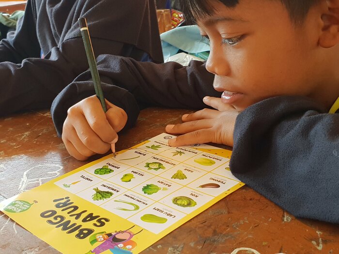 Child studying in a classroom