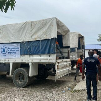 WFP staff preparing trucks to transport humanitarian assistance and personnel to access remote villages affected by the earthquake in Haiti