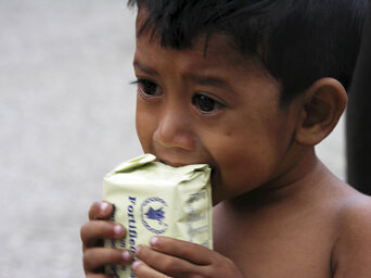 Child is eating WFP-fortified snack