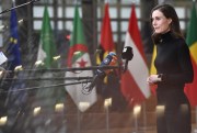 Finnish Prime Minister Sanna Marin speaks with the media as she arrives for an EU Africa summit in Brussels, Feb. 18, 2022 (AP photo by Geert Vanden Wijngaert).