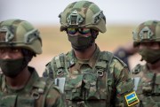 Rwandan armed forces prepare to board a flight to Mozambique