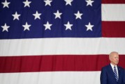 U.S. President Joe Biden listens as first lady Jill Biden speaks at Joint Base Langley-Eustis in Hampton, Va., May 28, 2021.