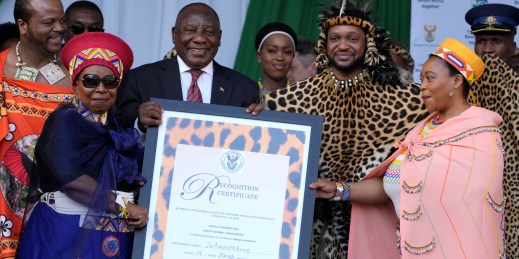 South African President Cyril Ramaphosa presents a certificate of recognition to King Misuzulu ka Zwelithini of the Zulu nation.